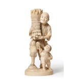 A Japanese Ivory Okimono, Meiji period, as a man carrying a bundle of faggots, a boy at his feet, on