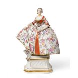 A Meissen Porcelain Figure of the Mopsoden, circa 1900, the standing lady wearing a crinoline,