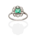 An Art Deco Emerald and Diamond Ring, an octagonal cut emerald within a pierced milgrain set old cut