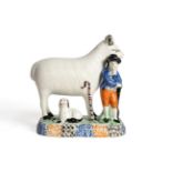 A Yorkshire Prattware Sheep Group, circa 1800, modelled as a shepherd standing next to a ewe, a lamb