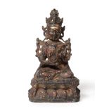 A Chinese Bronze Figure of Bodhisattva, probably 16th/17th century, seated, the left hand raised,