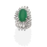 An 18 Carat White Gold Emerald and Diamond Cluster Ring, an oval cabochon emerald in a claw