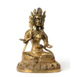 A Chinese Gilt Bronze Figure of Buddha, Yongle reign mark, seated wearing a scroll headdress on a