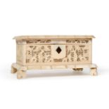 A Cantonese Ivory Casket, mid 19th century, the hinged cover carved with a vacant cartouche and