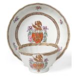 A Chinese Armorial Porcelain Tea Bowl and Saucer, Qianlong, painted in famille rose enamels with the