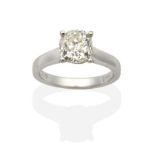 An 18 Carat White Gold Solitaire Diamond Ring, an old mine cut diamond in a claw setting, to