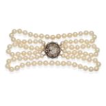A Triple Strand Cultured Pearl Collar Necklace, with a Diamond and Pearl Clasp, uniform cultured