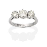 A Diamond Three Stone Ring, graduated round brilliant cut diamonds in claw settings, to knife edge