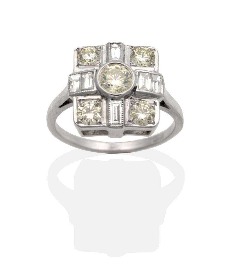 An Art Deco Style Diamond Cluster Ring, a square top with a central round brilliant cut diamond,