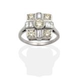 An Art Deco Style Diamond Cluster Ring, a square top with a central round brilliant cut diamond,