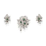 An Emerald and Diamond Brooch and Earrings Suite, the brooch formed of three flower heads, each with