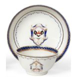 A Chinese Armorial Porcelain Tea Bowl and Saucer, Qianlong, painted in enamels and gilt with the