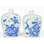 A Pair of Chinese Porcelain Flasks, Kangxi, of flattened baluster form, painted in underglaze blue