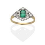 An Emerald and Diamond Ring, an octagonal cut emerald in a milgain setting, to a pierced lozenge-