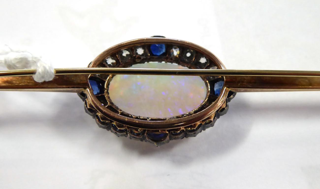 A Black Opal, Diamond and Sapphire Bar Brooch, an oval cabochon black opal, in a claw setting, - Image 3 of 5