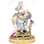 A Meissen Porcelain Figure Group of Lovers, circa 1880, each dressed in 18th century garb hung