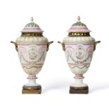 A Pair of Buen Retiro Porcelain Pot Pourri Vases and Covers, circa 1790, painted with neo-