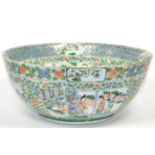 A Chinese Porcelain Punch Bowl, 19th century, painted in famille verte enamels with figures in