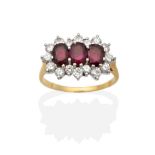 An 18 Carat Gold Ruby and Diamond Cluster Ring, three oval cut rubies within a border of round
