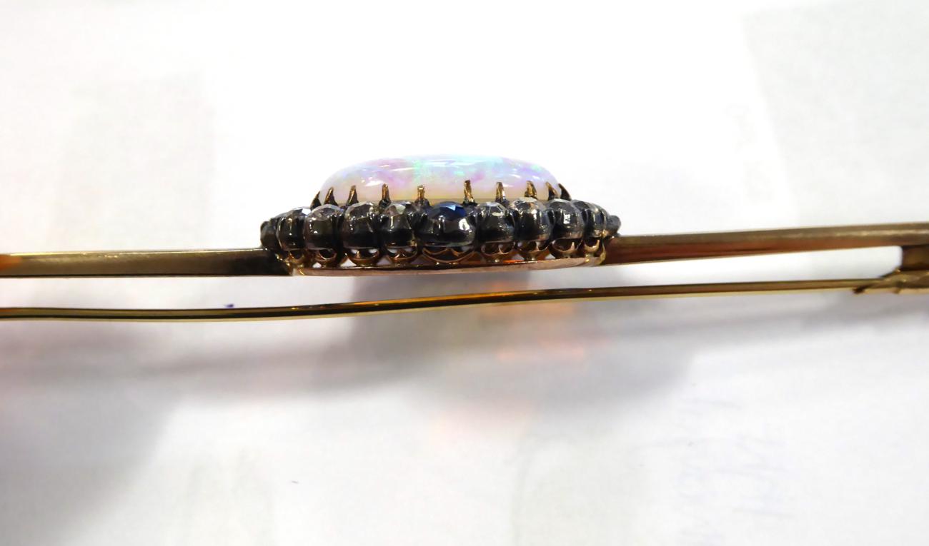 A Black Opal, Diamond and Sapphire Bar Brooch, an oval cabochon black opal, in a claw setting, - Image 5 of 5