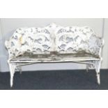 A Coalbrookdale Style White Painted Cast Iron Garden Bench, the back cast with ferns over a wooden