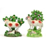 A Salt Pearlware Figure of a Ram, circa 1910, a lamb at its feet, on a mound base with bocage,