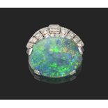 An Art Deco Black Opal and Diamond Clip Brooch, Signed 'Cartier London', an oval cabochon opal in