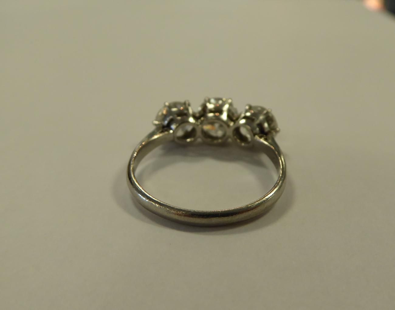 A Diamond Three Stone Ring, round transitional cut diamonds in claw settings, to knife edge - Image 4 of 6