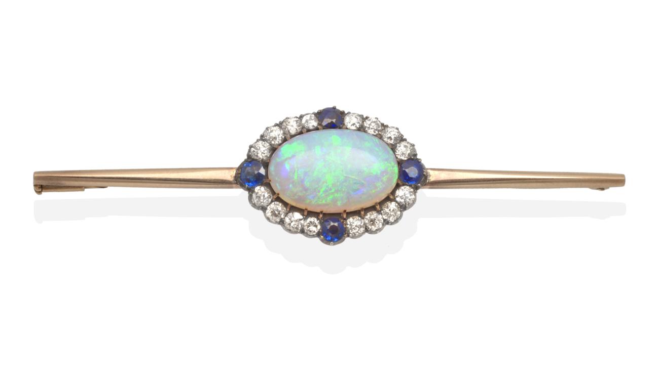 A Black Opal, Diamond and Sapphire Bar Brooch, an oval cabochon black opal, in a claw setting,