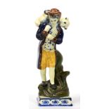 A Prattware Figure of the Lost Sheep, circa 1800, modelled as a standing shepherd holding a ewe