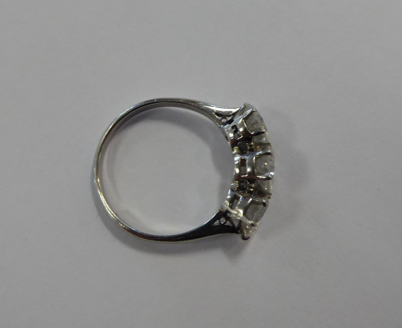 A Diamond Three Stone Ring, round transitional cut diamonds in claw settings, to knife edge - Image 2 of 6