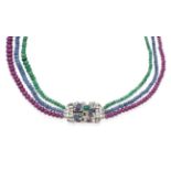 An 18 Carat White Gold Multi-Gemstone Necklace, graduated strands of emerald, sapphire and ruby