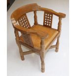 Mouseman: A Robert Thompson English Oak Monk's Chair, with curved back and shaped arms, over three