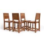 Mouseman: A Set of Four Robert Thompson English Oak Panel Back Dining Chairs, on octagonal front