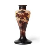 An Emile Gallé Cameo Vase, of tapering form, acid etched with an alpine landscape with trees by a