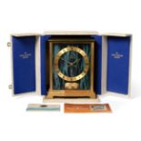 A Brass Atmos Clock, signed Jaeger LeCoultre, model: Embassy Green, circa 1972, case with faux green