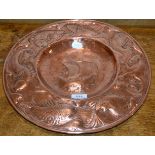 An Arts & Crafts Copper Charger, probably Newlyn, repousse decorated to the centre with a galleon in