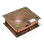 An Arts & Crafts Hammered Copper Casket, the domed rectangular top mounted to each corner with