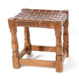 Mouseman: A Robert Thompson English Oak Stool, with lattice leather top, on four octagonal legs