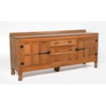 Mouseman: A Robert Thompson Panelled English Oak 6ft Sideboard, with raised upstand over two