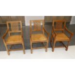 Mouseman: Three Robert Thompson English Oak Lattice Back Arm Chairs, curved arms, octagonal front