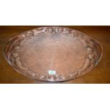 An Arts & Crafts Newlyn Copper Tray, of oval form, the pierced gallery with integral carrying