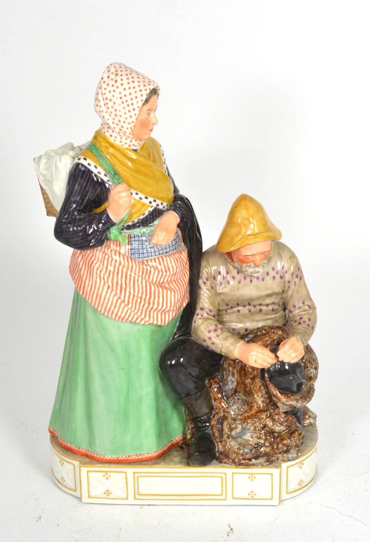 A Royal Copenhagen figure group 'Skovshoved, Man & Woman' by Carl Martin-Hansen, model number 12172,