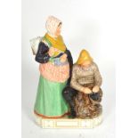 A Royal Copenhagen figure group 'Skovshoved, Man & Woman' by Carl Martin-Hansen, model number 12172,