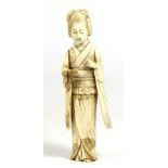 A Japanese Ivory Okimono, Meiji period, as a geisha holding a butterfly, 8cm high