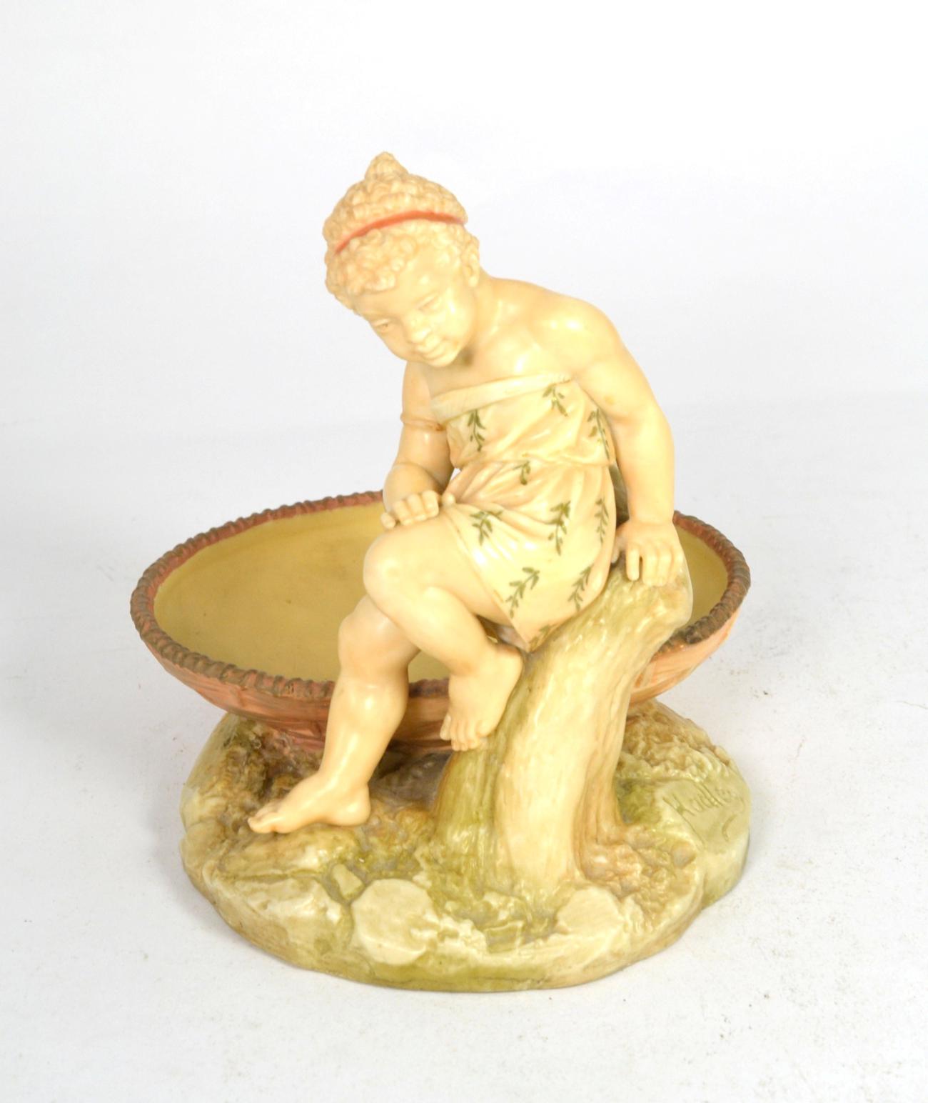 A Royal Worcester figural dish by James Hadley, shape number 1247, with impressed signature and date