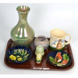 A group of Moorcroft pottery comprising: a 1986 year mug; a green lustre vase, 21cm; a small