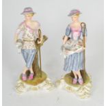 A pair of Royal Crown Derby figures, shepherd and shepherdess, each signed J Griffiths, each 24.5cm