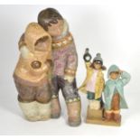 A large Lladro figure of Eskimos, 39cm, together with a smaller Lladro figure group of a boy and