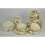 A Royal Doulton Moss Rose pattern part tea service for six comprising tea cups saucers side plates